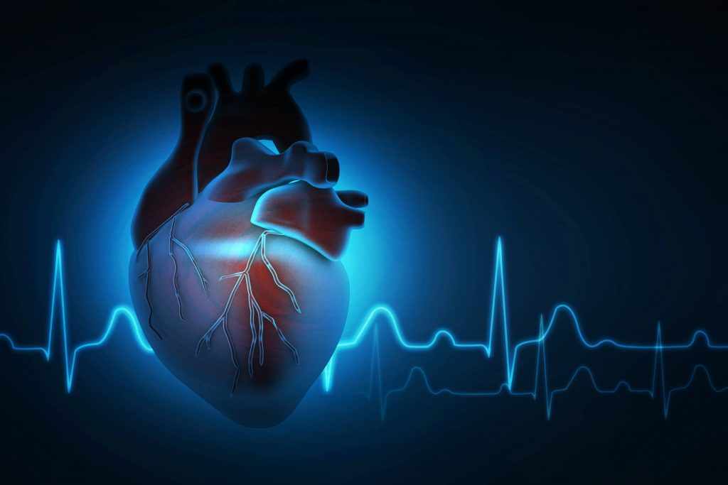 Heart with Blue EKG Lines Behind  - CVRTI Cardiac Arrhythmia Blog Image